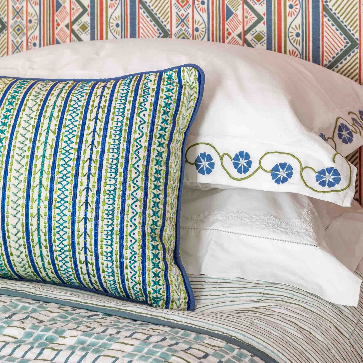 Capri embroidered blue green cushion Wicklewood