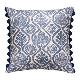 Floral nature blue printed cushion with navy blue scalloped trim.