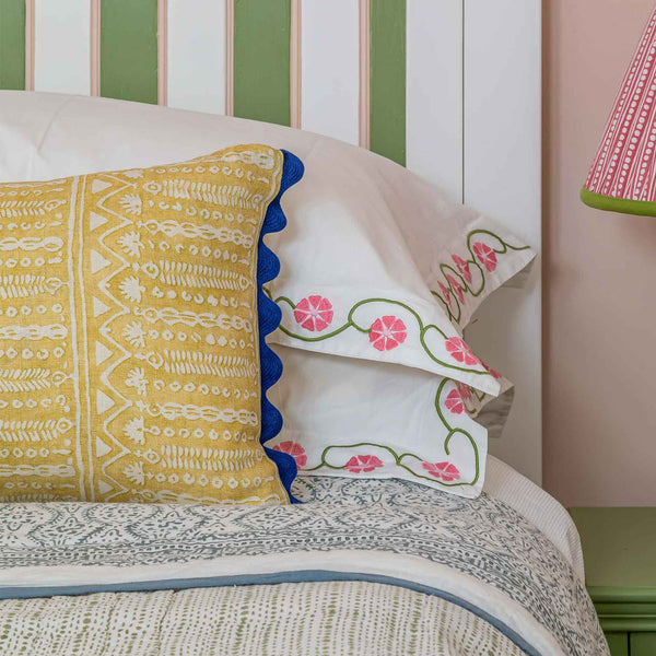 abingdon gold cushion with ric rac navy trim