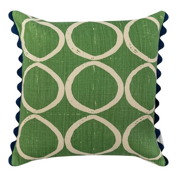 Circle print green square cushion with indigo scalloped trim