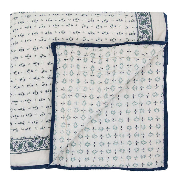 hand block printed reversible quilts from Wicklewood with a dark blue floral motif