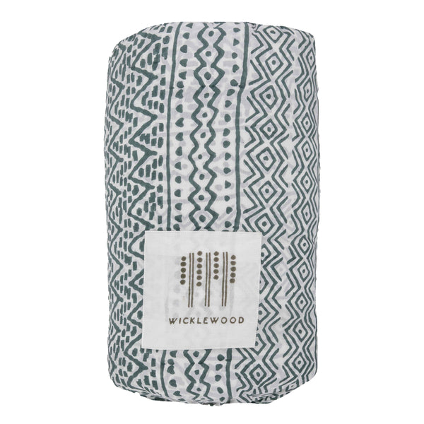 A grey blue hand block printed reversible quilt from Wicklewood with a zig zag motif