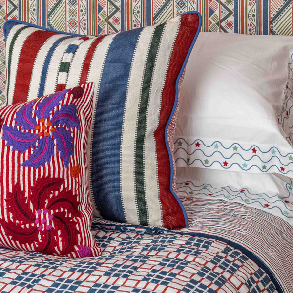 pillow case with blue geometric aztec embroidered motif