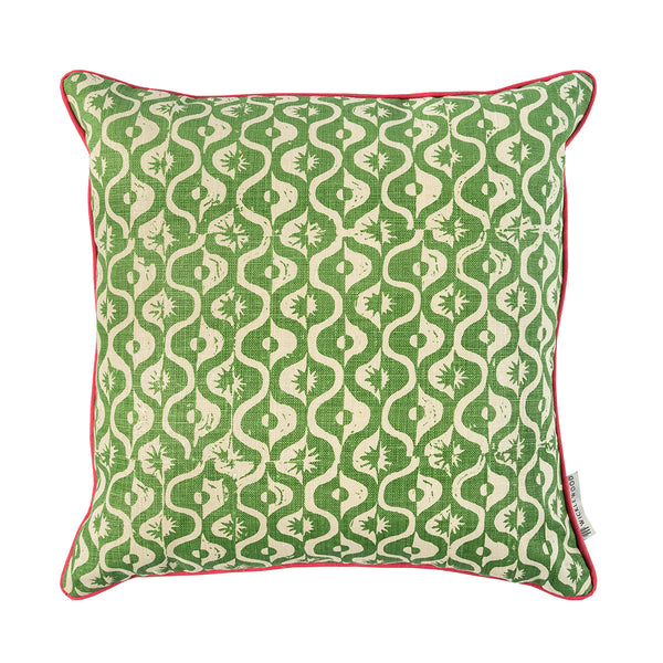 Geometric floral motif green square cushion with pink trim.