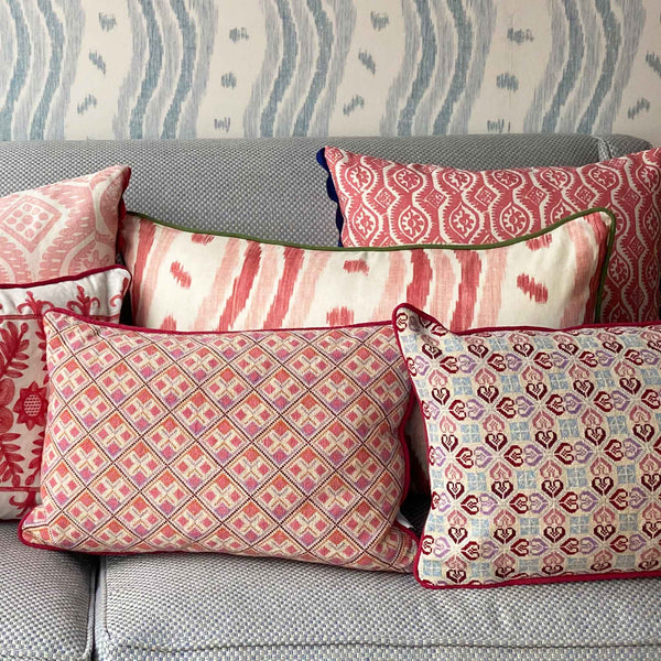 ikat stripe patterned pink red cushion