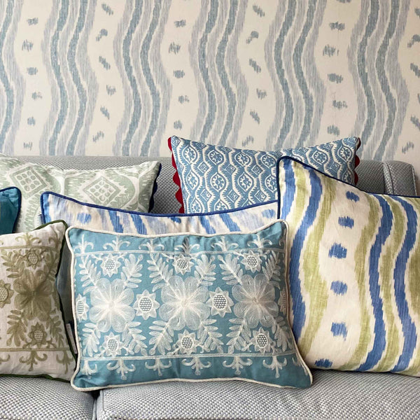 small damask patterned blue white cushion